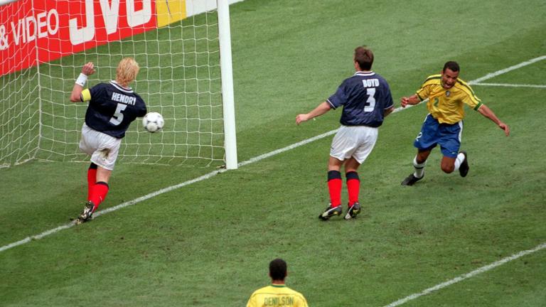 1998 World Cup Finals, St Denis, Paris, 10th June, 1998, Brazil 2 v Scotland 1, Scotland's Tommy Boyd (3) concedes an own goal for Brazil's winner as Cafu (R) celebrates (Photo by Popperfoto via Getty Images/Getty Images)