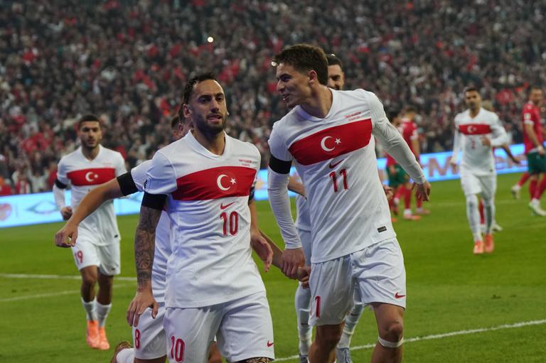 ISTANBUL, TURKEY - NOVEMBER 15: Hakan Calhanoglu (10) of Turkey celebrates after scoring the first goal of his team with Arda Guler (8) and Kenan Yildiz (11) during the FIFA World Cup 2026 qualifier match between Türkiye and Bulgaria at Buyuksehir Belediye Stadium on November 15, 2025 in Bursa, Turkey. (Photo by Seskim Photo/MB Media/Getty Images)