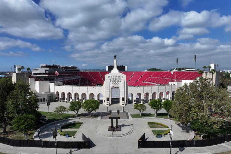 LOS ANGELES, CALIFORNIA - OCTOBER 01: A general overall aerial view of the Los Angeles Memorial Coliseum peristyle and Olympic Torch on October 01, 2025 in Los Angeles, California. (Photo by Kirby Lee/Getty Images)