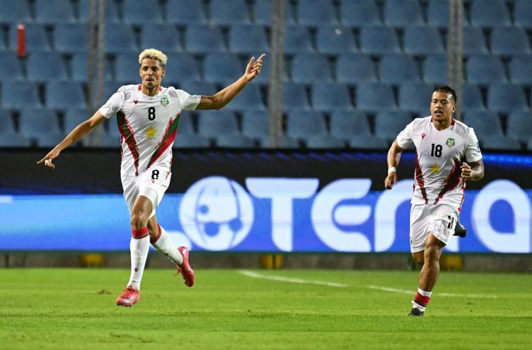 Suriname's midfielder #08 Justin Lonwijk (L) celebrates next to teammate midfielder #18 Jayden Turfkruier (R) after scoring his team's first goal during the 2026 FIFA World Cup Concacaf qualifier football match between El Salvador and Suriname at the Cuscatlan stadium in San Salvador on June 10, 2025. (Photo by Marvin RECINOS / AFP) (Photo by MARVIN RECINOS/AFP via Getty Images)